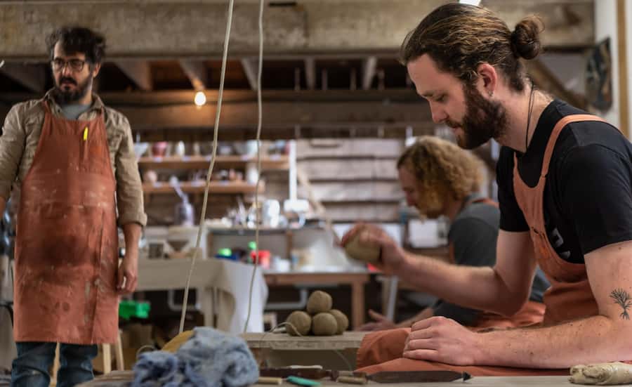 Coromandel: Wheel Throwing Pottery Class - Sitting at the wheel with New Zealand clay