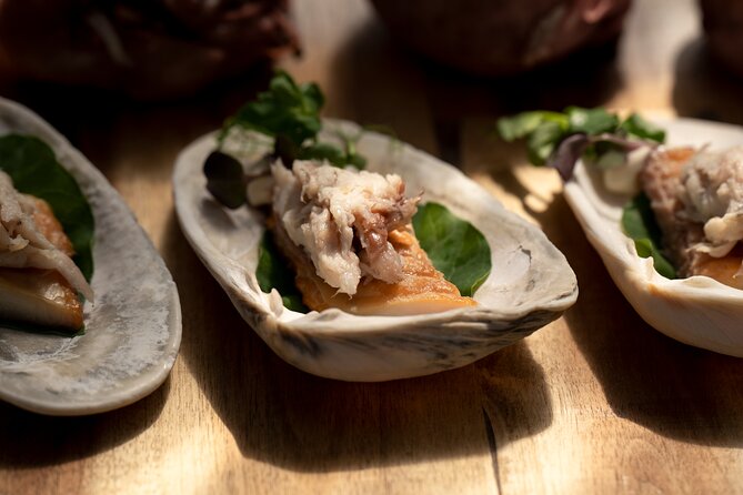 Cultural Experience & Seasonal Māori Cuisine at Te Pā Tū - Firelight, tawa trees, and weather