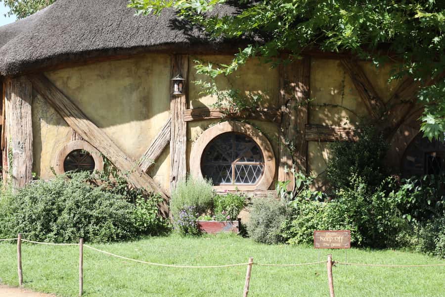 From Auckland: Hobbiton Afternoon Tour - Walking through Hobbiton’s carefully made details