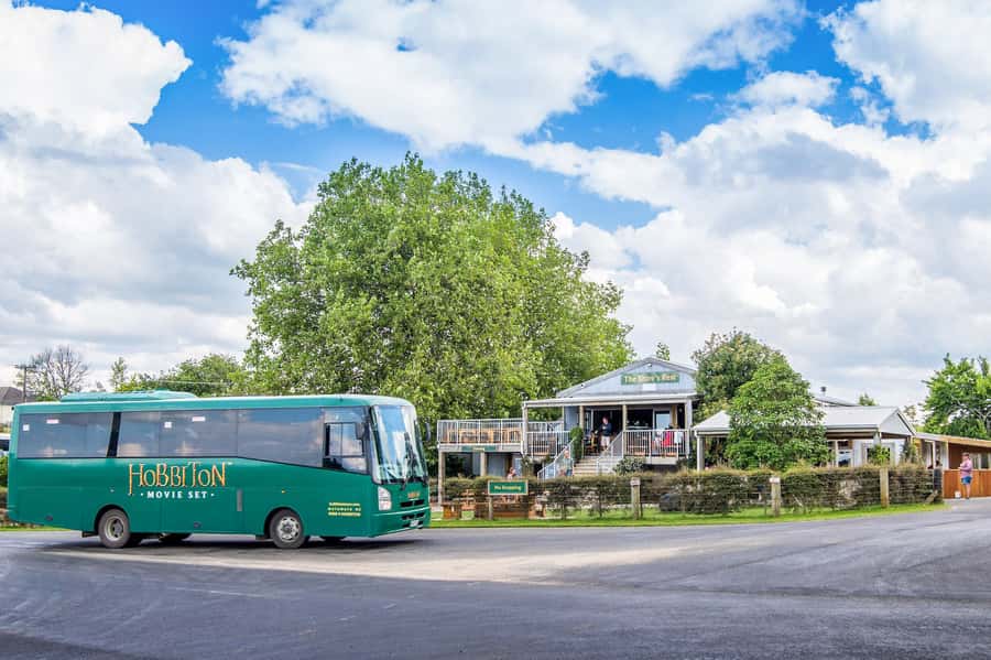 From Matamata: Guided Hobbiton Experience with Bus Transfers - The Mill, the pond, and the famous Green Dragon approach