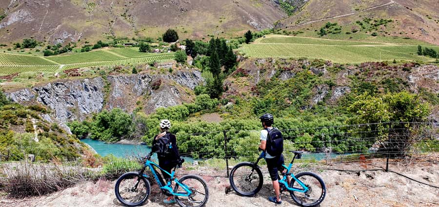 Queenstown: Guided E-Bike Tour with Winery Visits & Tastings - Rivers, suspension bridges, and the Kawarau stop
