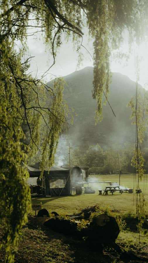 Queenstown: Riverside Sauna and Cold Plunge Experience - Warming up beside the outdoor fire