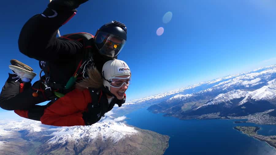 Queenstown: Tandem Skydive Experience - The climb above Queenstown begins in town