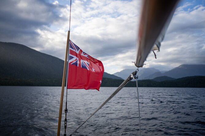 Scenic Cruise & Guided Walk on Historic Motor Yacht Lake Te Anau - Boarding Faith at the Te Anau wharf