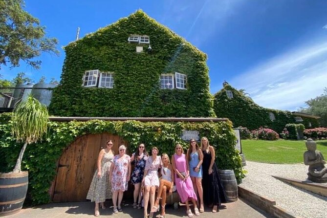 Waiheke Island Wine Tour with Scenic Vineyards & Tastings - The beach walk and the double-decker bus