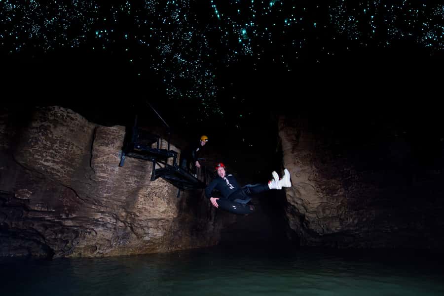 Waitomo Caves: Labyrinth Black Water Rafting Experience - Waterfalls, rock slides, and the fun parts